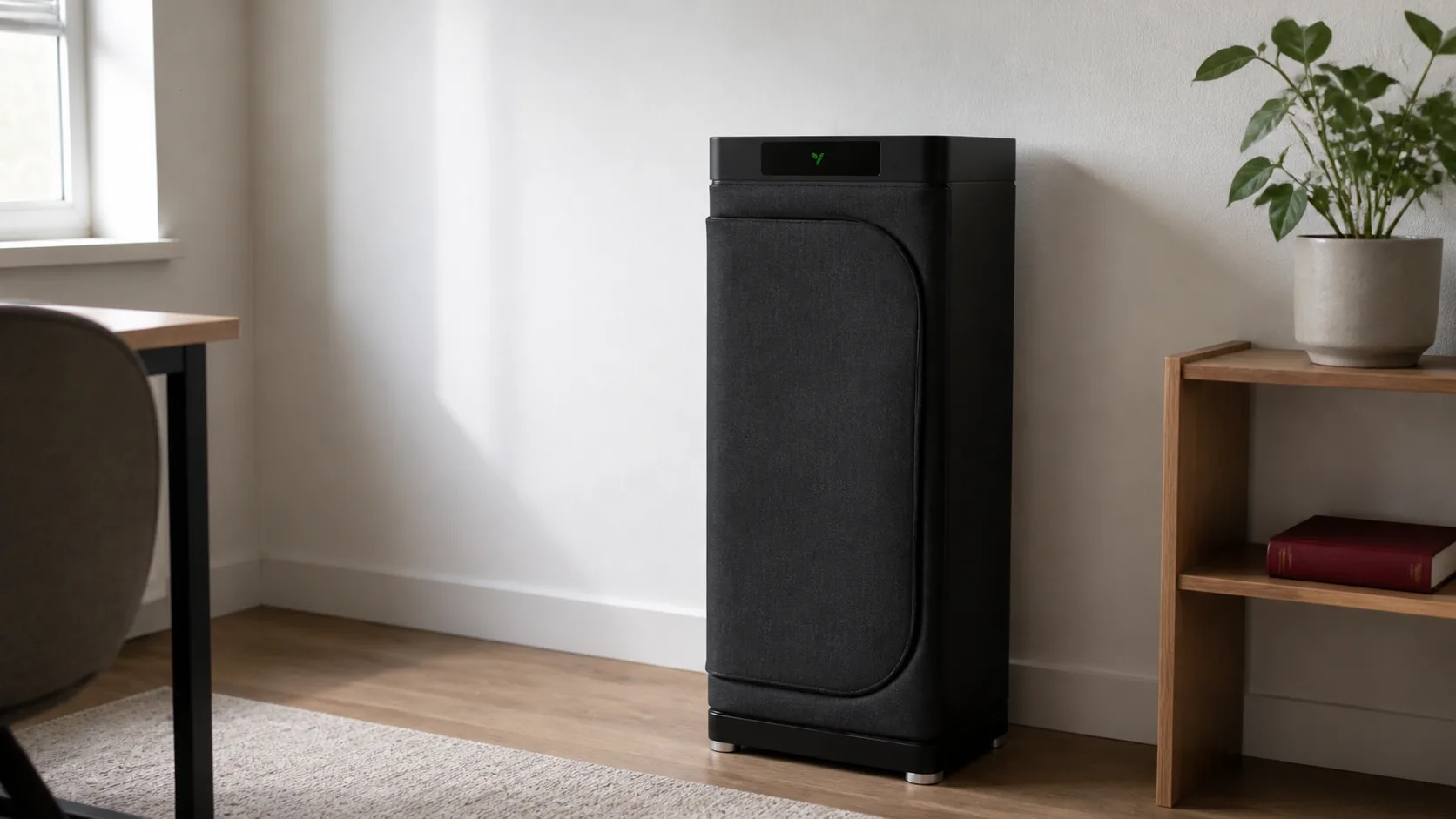 A compact black VGrow cabinet standing in a small home-office corner, showing how its footprint fits in a real room.